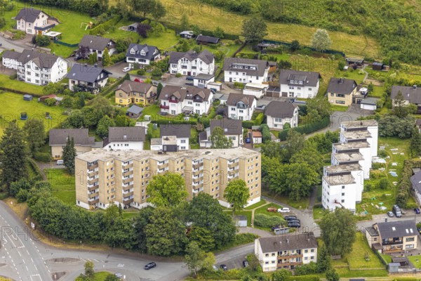 Aerial view, high-rise residential estate on Brandenburger Strasse, Bad Berleburg, Wittgensteiner Land, North Rhine-Westphalia, Germany, architecture, outdoor area, population density, Brandenburger Strasse, drone shot, roofs, buildings, green areas, high-rise buildings, horizons, infrastructure, landscape, apartment buildings, afternoon, settlement, summer, city view, urban development, urban planning, streets, urban, traffic, bird's eye view, suburb, residential building, housing estate, clouds, German city, European, modern life