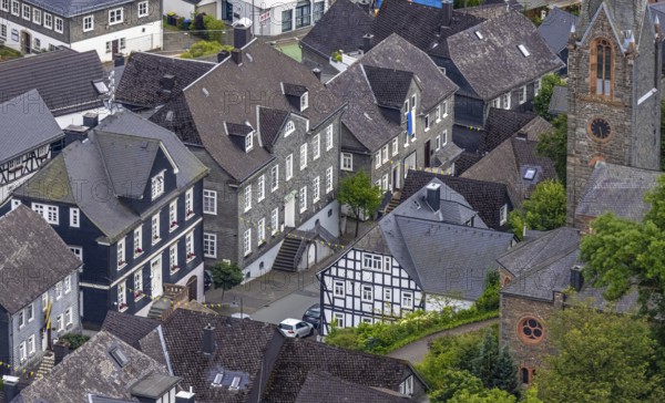 Aerial view, Protestant town church and green trees on Schlossstraße, residential area with historic houses, Bad Berleburg, Wittgensteiner Land, North Rhine-Westphalia, Germany, old town, architecture, view, roof, monument, village, building, faith, green trees, home, church, cultural heritage, landscape, nature, panorama, religion, Schlossstraße, summer, city, city view, cityscape, daylight, residential area, authentic, European city, Protestant town church, peaceful, cosy, historic houses, rural