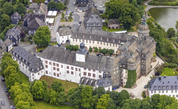 Aerial view, Berleburg Castle, residential castle of the Sayn-Wittgenstein family, Bad Berleburg, Wittgensteiner Land, North Rhine-Westphalia, Germany, noble family, architecture, exterior, castle, trees, roofs, heritage, Sayn-Wittgenstein family, building, culture, landscape, nature, panoramic view, residence, residential castle, palace, sight, tourism, tradition, environment, landmark, European, stately, historic, rural, medieval