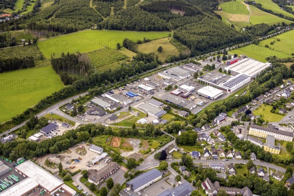 Aerial view, commercial area Herrenwiese, Bad Berleburg, Wittgensteiner Land, North Rhine-Westphalia, Germany, architecture, cars, roof view, development, factories, buildings, business, business activity, commercial areas, commercial area, Herrenwiese, sky, real estate scene, industrial area, infrastructure, warehouses, landscape, organisation, parking, region, town, streets, urban, company, economy, clouds, European