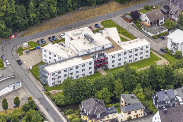 Aerial view, Friederike-Fliedner-Haus retirement home, Evang. Johanneswerk gGmbH nursing home, Mühlwiese, Bad Berleburg, Wittgensteiner Land, North Rhine-Westphalia, Germany, retirement home, old people's home, architecture, exterior view, care, village, facility, Evang. Johanneswerk gGmbH, Friederike-Fliedner-Haus, building, healthcare, green space, infrastructure, municipality, landscape, aerial view, care, care facility, nursing home, care for the elderly, retirement home, environment, residential building, institutional, rural