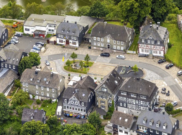 Aerial view, Goetheplatz in the town centre with Wilhelm I monument, historic houses, restaurants and cafés with parasols, Bad Berleburg, Wittgensteiner Land, North Rhine-Westphalia, Germany, old town, architecture, atmosphere, outdoor area, cafés, roofscape, Wilhelm I monument, monuments, relaxation, leisure, gastronomy, buildings, history, Goetheplatz, culture, lifestyle, people, town centre, squares, restaurants, sights, summer, parasols, town, town centre, tourism, public space