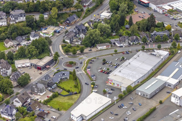 Aerial view, roundabout Poststrasse and Astenberger Strasse, Rewe supermarket, Bad Berleburg, Wittgensteiner Land, North Rhine-Westphalia, Germany, architecture, asphalt, Astenberger Strasse, shopping trolley, shopping centre, retail, vehicles, building, commercial, commercial area, sky, infrastructure, infrastructure planning, roundabout, parking, Poststrasse, region, town, roads, road junction, urban, traffic, traffic junction, Westphalia, European, local