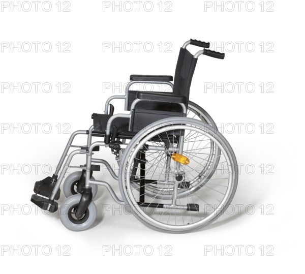 Studio photography of a empty wheelchair in white back with shadow