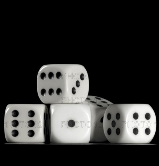 Surface angle closeup studio photography of some dice in dark back