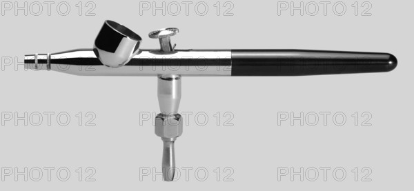 Isolated airbrush pistol in light grey back