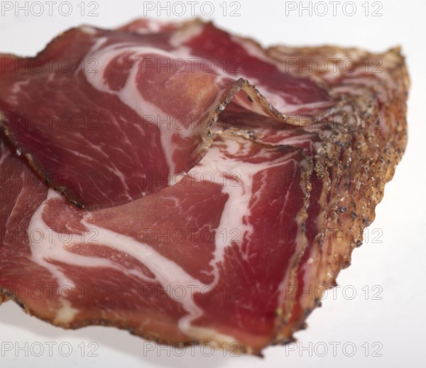 Closeup shot showing sliced raw ham pieces