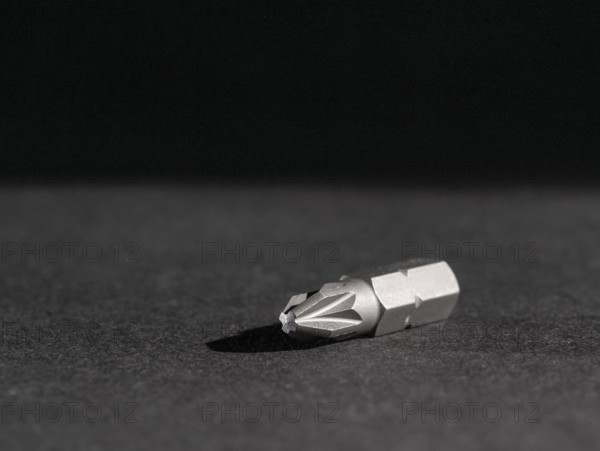 Closeup shot of a screwdriver bit in dark ambiance