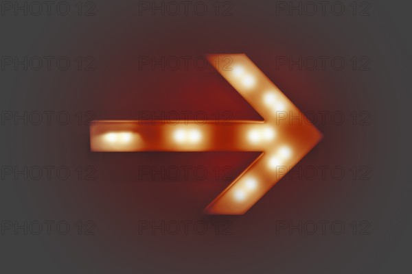 Red illuminated arrow on a wall in grey ambiance