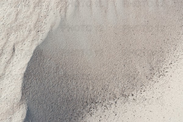 Full frame abstract sand background in sunny ambiance