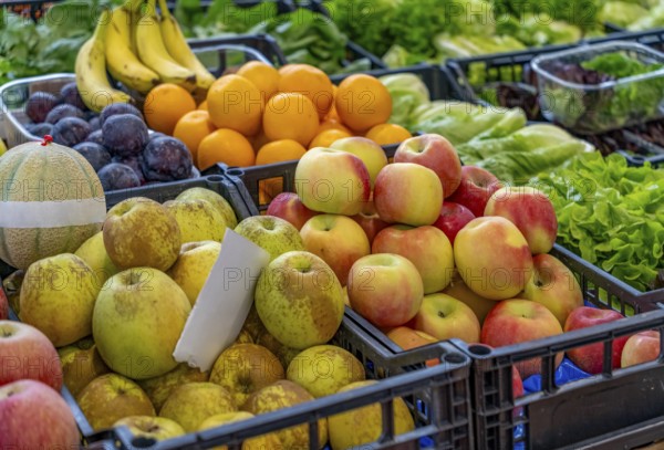 Various fruits and lettuce seen at a market in Liguria, a region of north-western Italy