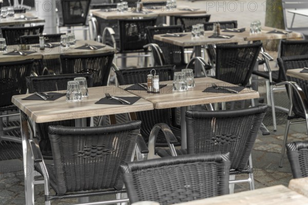 Outdoor scenery with tables and chairs seen in Normandy, France