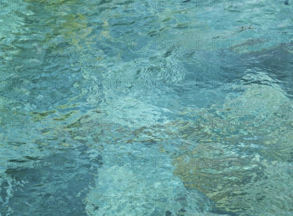 Full frame abstract blueish high angle water surface with little waves