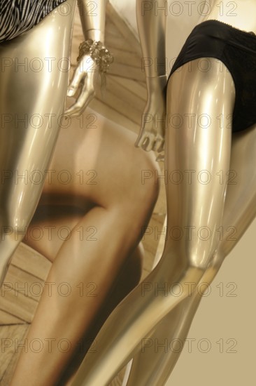Setail of some golden female dummies and lingerie