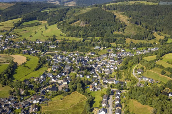 Aerial view, Heinsberg town centre and building site and renovation work on the church tower of the Catholic parish church of St. Katharina, Heinsberg, Kirchhundem, Sauerland, North Rhine-Westphalia, Germany, place of worship, construction work, construction area, construction site, scaffolding, building plots, construction project, construction site, DE, Europe, religious community, place of worship, holy place, church, parish, denomination, aerial view, aerial photography, aerial photography, religion, religious site, overview, bird's eye view, birds-eyes view, overview
