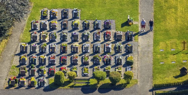 Aerial view, Langenei cemetery with colourful flower grave field, two visitors, shapes and colours, Langenei, Lennestadt, Sauerland, North Rhine-Westphalia, Germany, burial site, flower field, DE, Europe, cemetery, memorial site, Gottesacker, graves, grave field, Kirchhundem, aerial view, aerial photography, aerial photography, resting place, overview, bird's eye view, birds-eyes view, overview