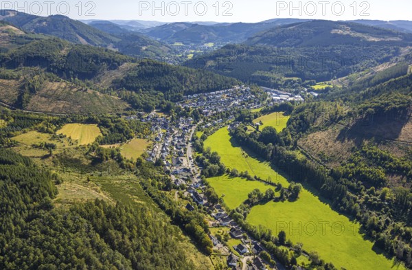 Aerial view, residential area, local view of Langenei in the valley of Fredeburger Straße in wooded hilly landscape with forest damage, Langenei, Lennestadt, Sauerland, North Rhine-Westphalia, Germany, tree mortality, DE, Europe, property tax, real estate, clear-cutting, calamity areas, Kirchhundem, aerial view, aerial photography, aerial photography, valley, overview, bird's-eye view, forest, forest damage, forest dieback, housing estate, housing and living, residential area, housing quality, residential neighbourhood, housing estate, residential area, birds-eyes view, overview