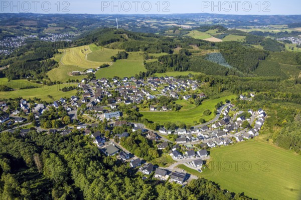 Aerial view, residential area, view of Halberbracht district with wooded hilly landscape, wind turbine in the forest, Lennestadt, Sauerland, North Rhine-Westphalia, Germany, DE, Europe, property tax, real estate, Kirchhundem, aerial view, aerial photography, aerial photography, overview, bird's-eye view, forest, residential area, housing and living, residential area, quality of life, residential neighbourhood, housing estate, residential district, bird's-eye view, overview