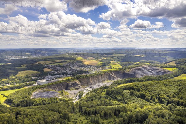 Aerial view, quarry Ebel Steinbruchbetriebe Werk Habbel, distant view and blue sky with clouds, Müschede, Arnsberg, Sauerland, North Rhine-Westphalia, Germany, quarry, Ebel Steinbruchbetriebe, Werk Habbel, distant view, blue sky, clouds, nature, industry, landscape, opencast mining, raw materials, aerial view, perspective, geology, environment, sky, stone, region, mining, outdoor shot