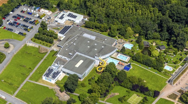 Aerial view, Solepark Große Wiese leisure pool wet with water slide, sunbathing lawn and swimming pool, graduation house salt works, car parks, Hüsten, Arnsberg, Sauerland, North Rhine-Westphalia, Germany, Solepark, Große Wiese, leisure pool, water slide, sunbathing lawn, swimming pool, graduation house, salt works, park, summer, leisure, recreation, bathing fun, families, children, adults, fun, water, nature, attractions, infrastructure, public, tourism, landscape, bird's eye view, swimming, slides, sunshine, outdoor, leisure centre