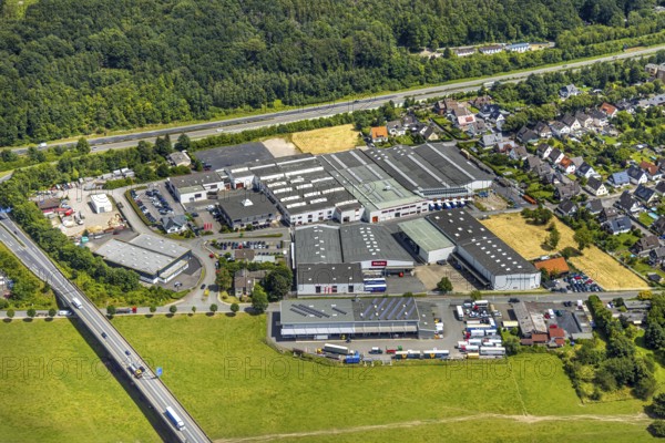 Aerial view, industrial estate Unterm Breloh, Miele plant, Hüsten, Arnsberg, Sauerland, North Rhine-Westphalia, Germany, industrial estate, Unterm Breloh, industry, factory, building, infrastructure, city, landscape, commercial, company, aerial view, architecture, production, economy, jobs, business, factory building, sky, server landscape, urban, development, business area, roofs, mechanical, plant, logistics, traffic, structure