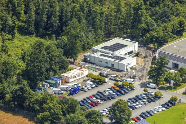 Aerial view, construction site at the Solepark next to the Solepark Große Wiese Freizeitbad Naß, Hüsten, Arnsberg, Sauerland, North Rhine-Westphalia, Germany, construction site, Solepark, leisure pool, Naß, Große Wiese, crane, machines, construction workers, structure, building, development, construction phase, infrastructure, leisure facility, swimming pool, urban, birds-eye view, landscape, urban planning, progress, industry, construction project, area, construction site vehicles, modern, Europe, area, summer, day, clear, sky