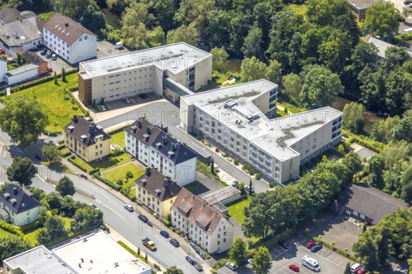 Aerial view, new construction of the Ruhrblick retirement home in Clemens-August-Straße, Obereimer, Arnsberg, Sauerland, North Rhine-Westphalia, Germany, new construction, retirement home, Ruhrblick, Clemens-August-Straße, building, roof, flats, nursing home, architecture, modern, infrastructure, city, environment, green spaces, river, landscape, construction project, development, urban, residential building, urban planning, perspective, drone shot, real estate, urban district