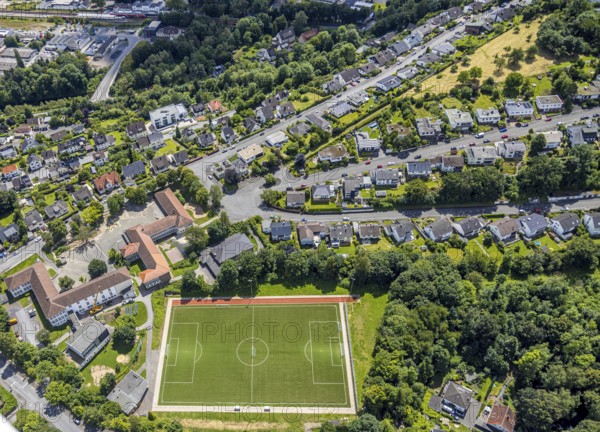 Aerial view, football stadium sports field Schreppenberg, Regenbogenschule and Fröbelschule, residential area Milanweg, Obereimer, Arnsberg, Sauerland, North Rhine-Westphalia, Germany, football stadium, sports field, Schreppenberg, Regenbogenschule, Fröbelschule, residential area, Milanweg, educational facilities, architecture, urban, infrastructure, schools, residential area, playing field, sports facilities, aerial view, building, residential areas, landscape, urban area, modern, environment, streets, green areas, roofs, urban, topography, building view