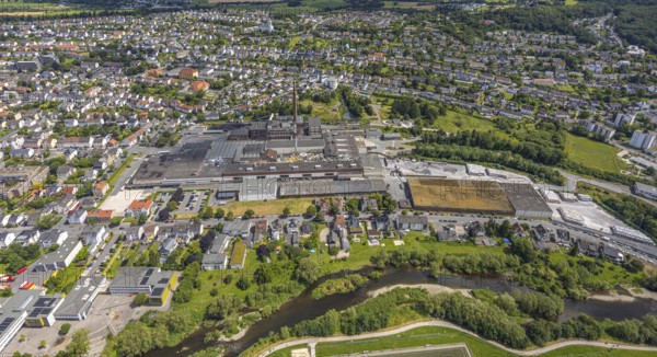 Aerial view, Reno de Medici plant for cardboard products on the river Ruhr, RDM Group, residential area, Arnsberg, Sauerland, North Rhine-Westphalia, Germany, Reno de Medici, plant, cardboard, products, river Ruhr, factory, industry, production, river, landscape, building, city, structure, commercial area, nature, green areas, roofs, infrastructure, aerial view, bird's eye view, European, summer, blue, sky, clouds
