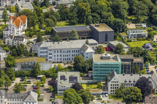Aerial view, district house and district government, building renovation with cladding and scaffolding, behind the Gymnasium Laurentianum, Arnsberg, Sauerland, North Rhine-Westphalia, Germany, district house, district government, building, renovation, cladding, scaffolding, Gymnasium Laurentianum, renovation, architecture, construction site, authority building, school building, city view, aerial view, modernisation, construction work, institutions, education, administration, construction, urban, maintenance, reconstruction, infrastructure, security measures, scaffolding, office building, educational institution