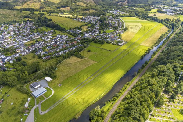 Aerial view, Ruhraue and gliding area Oeventrop-Ruhrwiesen, meadow landscape at the river Ruhr, railway line, Glösingen, Arnsberg, Sauerland, North Rhine-Westphalia, Germany, Ruhraue, gliding area, Oeventrop-Ruhrwiesen, meadow landscape, river Ruhr, nature, green area, river landscape, meadows, railway, village, landscape, aerial view, summer, daylight, open space, region, rural, recreation, view, riverside, topography, cloudless, sky, panorama, wide view