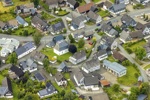 Aerial view, protestant church in the village centre and half-timbered houses, Berghausen, Bad Berleburg, Wittgensteiner Land, North Rhine-Westphalia, Germany, Old Town, architecture, village, village centre, protestant church, half-timbered houses, building complex, sky, idyllic, church, culture, cultural heritage, landscape, village centre, panoramic view, religion, place of interest, settlement, cityscape, historic buildings, high, rural, picturesque, rooftops, traditional, overview