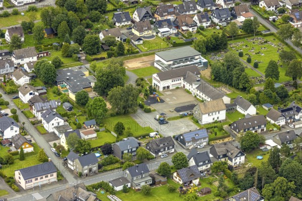 Aerial view, primary school to children's centre and residential area, Berghausen, Bad Berleburg, Wittgensteiner Land, North Rhine-Westphalia, Germany, architecture, education, village, recreation, upbringing, area, building, community, primary school, green area, houses, infrastructure, children, children's centre, teacher, neighbourhood, school, settlement, daylight, environment, bird's eye view, residential area, flats, German, village, scenic, rural, nature