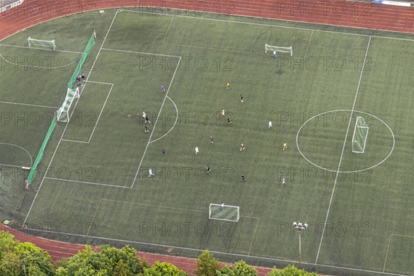 Aerial view, football stadium athletics stadium Auf dem Stöppel, sports field Bad Berleburg, youth players on the field, Bad Berleburg, Wittgensteiner Land, North Rhine-Westphalia, Germany, architecture, athletes, Auf dem Stöppel, outdoor shot, field, leisure, football stadium, green area, infrastructure, youth, youth players, children, landscape, athletics stadium, team, panorama, lawn, summer, pitch, sport, sports facility, sports field, day, training, stands, competition, rural