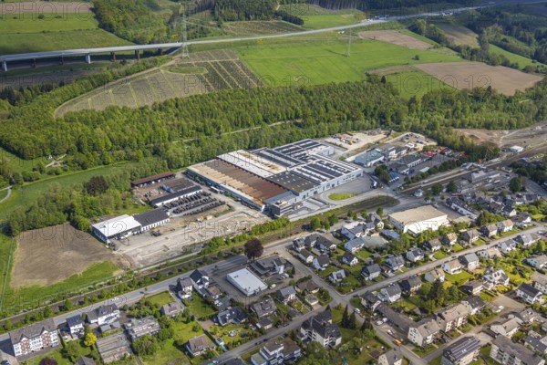 Aerial view, Bestwig M. bush GmbH plant, A46 motorway, Bestwig, Sauerland, North Rhine-Westphalia, Germany, plant, M. bush GmbH, factory, industry, traffic, motorway, road, landscape, building, aerial view, city, infrastructure, engineering, structure, transport, region, economy, trade, development, exterior view, technology, architecture, environment, cityscape, obscured view, company