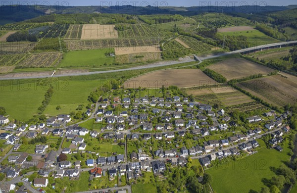 Aerial view, residential area, view of Velmede district surrounded by meadows and fields, tree plantations on the A46 motorway, agricultural areas, Velmede, Bestwig, Sauerland, North Rhine-Westphalia, Germany, residential area, view of district, district, meadows, fields, tree plantations, motorway, A46, landscape, houses, streets, nature, environment, infrastructure, village, region, green areas, rural, home, settlement, aerial view, panorama, vegetation