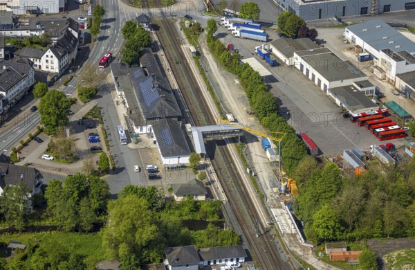 Aerial view, Bestwig railway station, Deutsche Bahn AG, construction site with construction crane, covered pedestrian crossing, Bestwig, Sauerland, North Rhine-Westphalia, Germany, construction site, construction crane, pedestrian crossing, covered, railway, infrastructure, construction work, transport, architecture, traffic junction, train, rail, station, city, urban, commuter, traveller, construction, development, aerial view, facility, building, spring, daylight, crane, tracks, bridge, public transport
