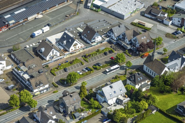 Aerial view, shopping area at the federal road B7, Zum Alten Güterbahnhof, parking, evang. Kreuzkirche, Bestwig, Sauerland, North Rhine-Westphalia, Germany, shopping area, federal road B7, car, church, shops, infrastructure, urban, car park, building, road, traffic, connection, shopping centre, environment, architecture, retail trade, region, landscape, settlement, sky, outdoor area, federal road, municipality, aerial view, village
