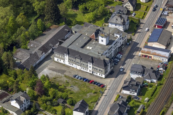 Aerial view, Schneider Korn distillery, H. & F. Schneider Holding GmbH & Co. KG Spirituosenhandel, Ostwig, Bestwig, Sauerland, North Rhine-Westphalia, Germany, Schneider Korn, Kornbrennerei, H. KG, Spirituosenhandel, building, architecture, company, industry, landscape, sky, clouds, business, factory, alcohol production, distillery, spirits, production, rural, infrastructure, nature, land, bird's eye view, services, traditional production
