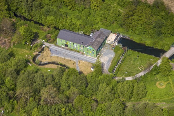 Aerial view, old hydroelectric power station Alfert, NaturRanger e.V., and green house painted with animals and plants, Ostwig, Bestwig, Sauerland, North Rhine-Westphalia, Germany, hydroelectric power station, painted house, green house, building, architecture, painting, art, animals, plants, landscape, nature, power generation, renewable energy, environment, historical, sustainability, vegetation, river, forest, rural, infrastructure, environmentally friendly, tourism, view, energy, ecological