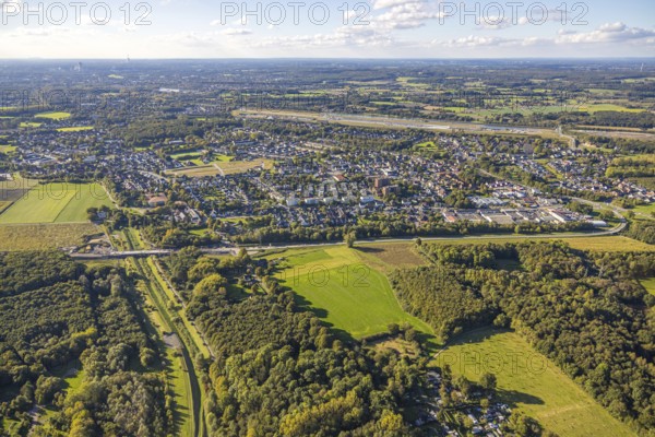 Aerial view, bypass construction site with bridge construction of the state road L821n over the Kuhbach, view to Oberaden, distant view and blue sky with clouds, Bergkamen, Ruhr area, North Rhine-Westphalia, Germany, architecture, construction work, construction project, construction site, bridge, bridge construction, development, distant view, river, progress, sky, infrastructure, construction, Kuhbach, L821n, state road, landscape, nature, Oberaden, bypass, perspective, region, summer, city, daylight, technology, transport, environment, traffic, clouds, blue sky, rural, modern