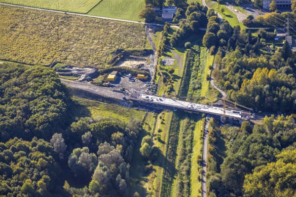 Aerial view, bypass construction site with bridge construction of the state road L821n over the Kuhbach, Oberaden, Bergkamen, Ruhr area, North Rhine-Westphalia, Germany, bypass, construction site, bridge construction, state road, L821n, Kuhbach, infrastructure, construction, road construction, river, bridge, development, urban planning, construction project, construction work, traffic management, landscape, engineering, vehicle traffic, technology, modern, construction site vehicles, machinery, topographical, bypass, infrastructure projects, transport, connection, architecture, construction industry, earthworks, engineering, development, regional, transport network, environment, progress