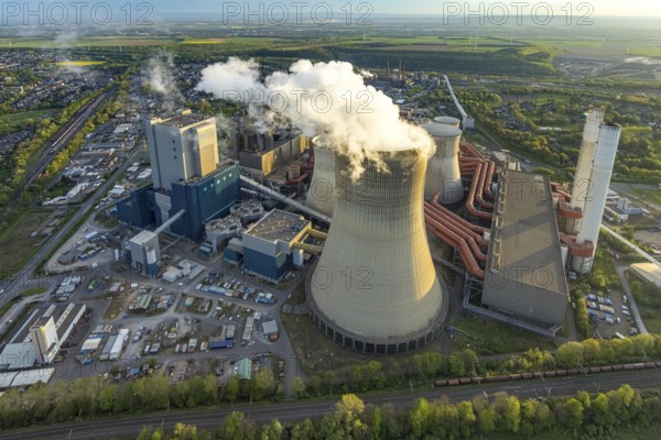 Aerial view, Niederaussem lignite-fired power plant, RWE Power AG power plant site, cooling towers and smoke clouds, distant view, Bergheim, Rhineland, North Rhine-Westphalia, Germany, lignite-fired power plant, Niederaussem, RWE Power AG, cooling towers, smoke clouds, energy, industry, pollution, power generation, technology, infrastructure, landscape, sky, emissions, chimney, coal energy, power plant, air pollution, energy production, industrial, ecology, climate change, sustainability, supply, energy industry, smoke, environment, economy, power plant