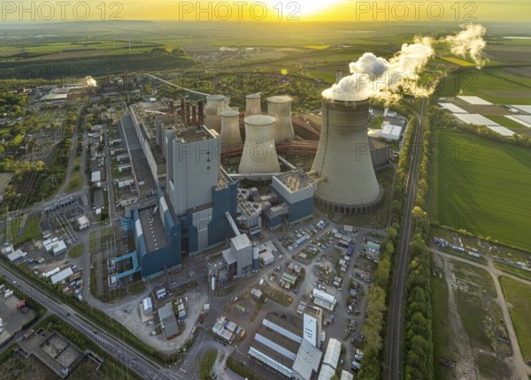 Aerial view, Niederaussem lignite-fired power plant, power plant site of RWE Power AG, cooling towers and smoke clouds, distant view, Bergheim, Rhineland, North Rhine-Westphalia, Germany, lignite-fired power plant, Niederaussem, RWE Power AG, cooling towers, smoke clouds, industry, energy production, pollution, air pollution, energy, power generation, infrastructure, technology, landscape, view from above, architecture, power plant site, environment, emissions, CO2, power plant, industrial, energy industry, sustainability, clouds, sky, outdoors