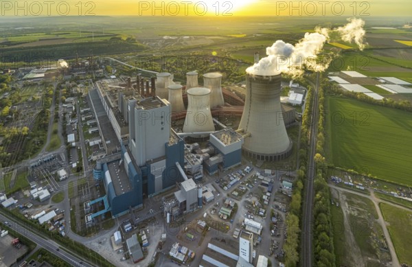 Aerial view, Niederaussem lignite-fired power plant, power plant site of RWE Power AG, cooling towers and smoke clouds, distant view, Bergheim, Rhineland, North Rhine-Westphalia, Germany, lignite-fired power plant, Niederaussem, RWE Power AG, power plant site, cooling towers, smoke clouds, industry, energy, pollution, emissions, landscape, technology, infrastructure, air pollution, energy production, coal power, aerial view, smoke, energy industry, electricity production, industrial landscape, environment, sustainability, power plant, electricity, energy source, technology, sky, perspective