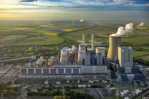 Aerial view, lignite-fired power plant Niederaussem, power plant site of RWE Power AG, cooling towers and smoke clouds, distant view, behind the RWE Power AG power plant Neurath, Bergheim, Rhineland, North Rhine-Westphalia, Germany, lignite-fired power plant, Niederaussem, RWE Power AG, cooling towers, smoke clouds, power plant Neurath, energy, industry, pollution, emissions, power generation, technology, infrastructure, landscape, air pollution, perspective, environmentally conscious, CO2 emissions, renewable energy, sustainability, climate change, energy source, fossil fuels, industrial landscape, panorama, ecology, economy