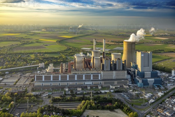 Aerial view, lignite-fired power plant Niederaussem, power plant site of RWE Power AG, cooling towers and smoke clouds, distant view, behind the RWE Power AG power plant Neurath, Bergheim, Rhineland, North Rhine-Westphalia, Germany, lignite-fired power plant, Niederaussem, power plant site, RWE Power AG, cooling towers, smoke clouds, Neurath, energy production, industry, environment, smoke, emissions, technology, infrastructure, landscape, sky, pollution, power generation, energy, coal-fired power plant, supply, electricity plant, power station, architecture, industrial landscape, building, energy supply, industrial, ecological footprint, air pollution, energy production, electricity, sustainability, CO2 emissions