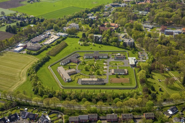 Aerial view, Forensic Psychiatry - LVR Clinic, special psychiatric facilities, circular garden, residential area local view Bedburg-Hau, Hau, Bedburg-Hau, Lower Rhine, North Rhine-Westphalia, Germany, architecture, treatment, trees, top view, facility, forensic psychiatry, garden, building, community, health care, health care system, green areas, LVR clinic, landscape, aerial view, medicine, local view, care, planning, psychiatry, security, special clinic, town, town view, structure, urban, supply, residential area, circular, public building