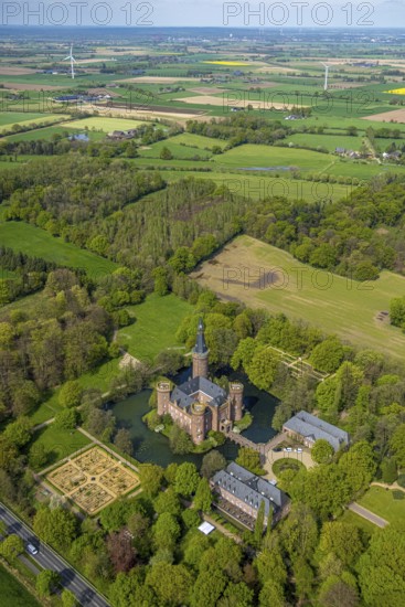Aerial view, Museum Schloss Moyland, neo-Gothic moated castle and castle park surrounded by meadows and fields and forest, excursion destination on the Lower Rhine, Moyland, Bedburg-Hau, Lower Rhine, North Rhine-Westphalia, Germany, complex, architecture, excursion destination, exterior view, visit, trees, recreation, fields, leisure, building, history, green, sky, culture, landscape, museum, nature, park, tranquillity, Moyland Castle, castle park, beauty, sight, day, tourism, forest, water, meadows, European, historical, neo-Gothic moated castle
