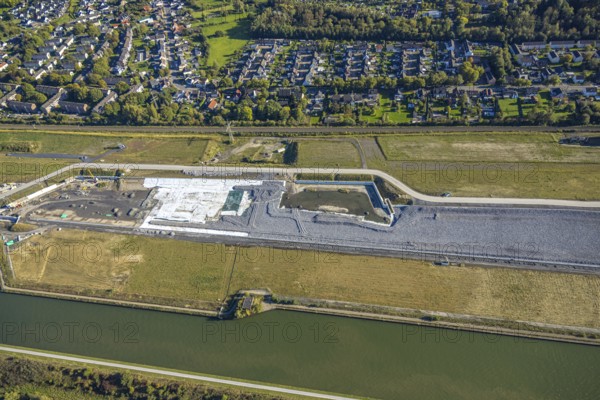 Aerial view, Water City Aden on the Datteln-Hamm Canal, construction area for planned urban quarter on the site of the former Haus Aden colliery, Oberaden, Bergkamen, Ruhr area, North Rhine-Westphalia, Germany, Water City, Aden, Datteln-Hamm Canal, construction area, planned urban quarter, site, former colliery, Haus Aden, urban development, architecture, urban planning, infrastructure, site overview, river, canal system, northern Germany, construction projects, landscape, bird's eye view, urbanisation, industrial area, topography, settlement development